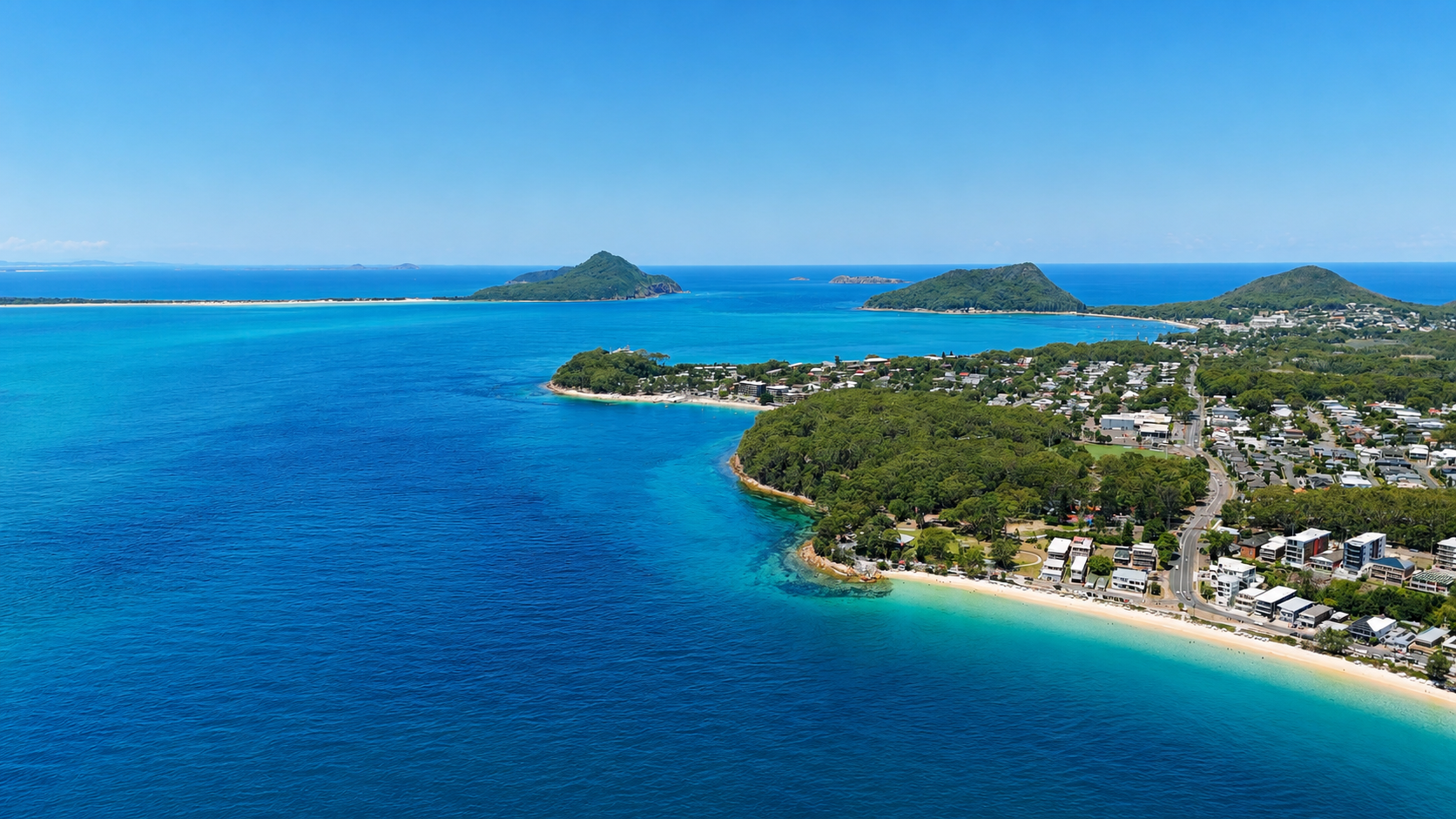 Aerial view of Nelson Bay, Port Stephens with turquoise water and boats
